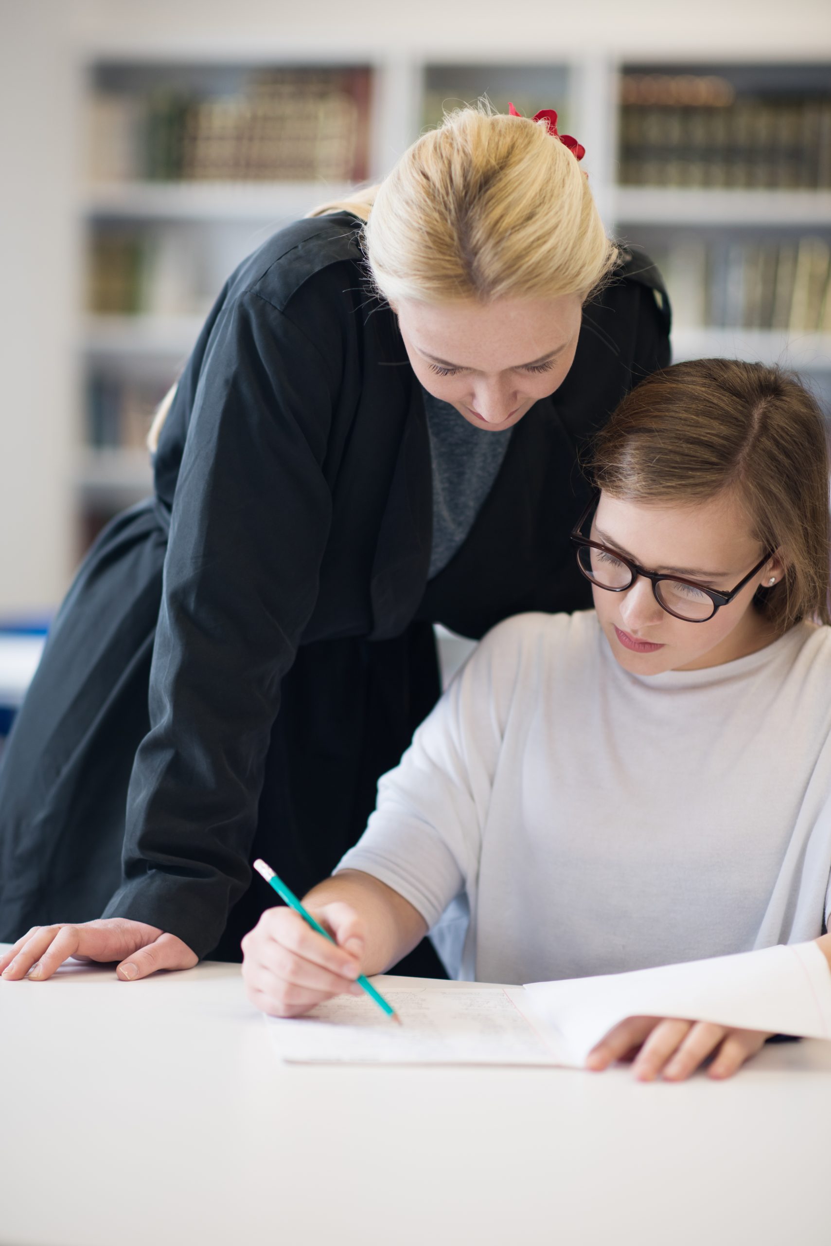 Tutor of Dragons tutor working one-on-one with a student on Credit by Exam preparation in Southlake