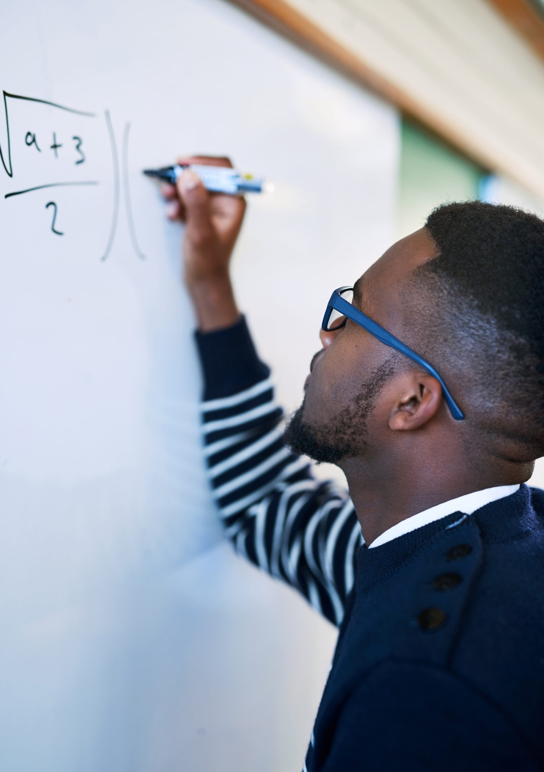 Middle school student smiling while working through Pre-Algebra practice problems with Tutor of Dragons in Southlake, Texas